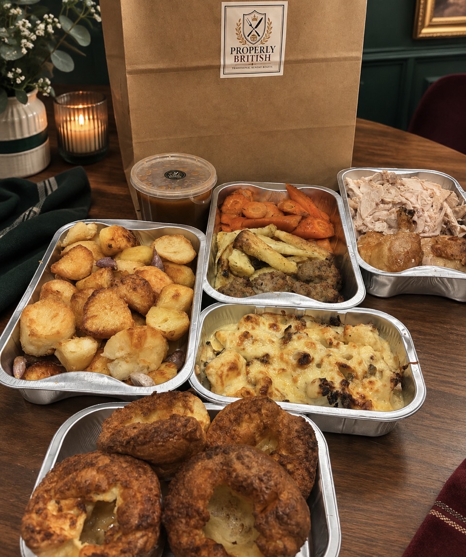 Freshly packaged Sunday roast ready for collection — Properly British branded bag and takeaway containers